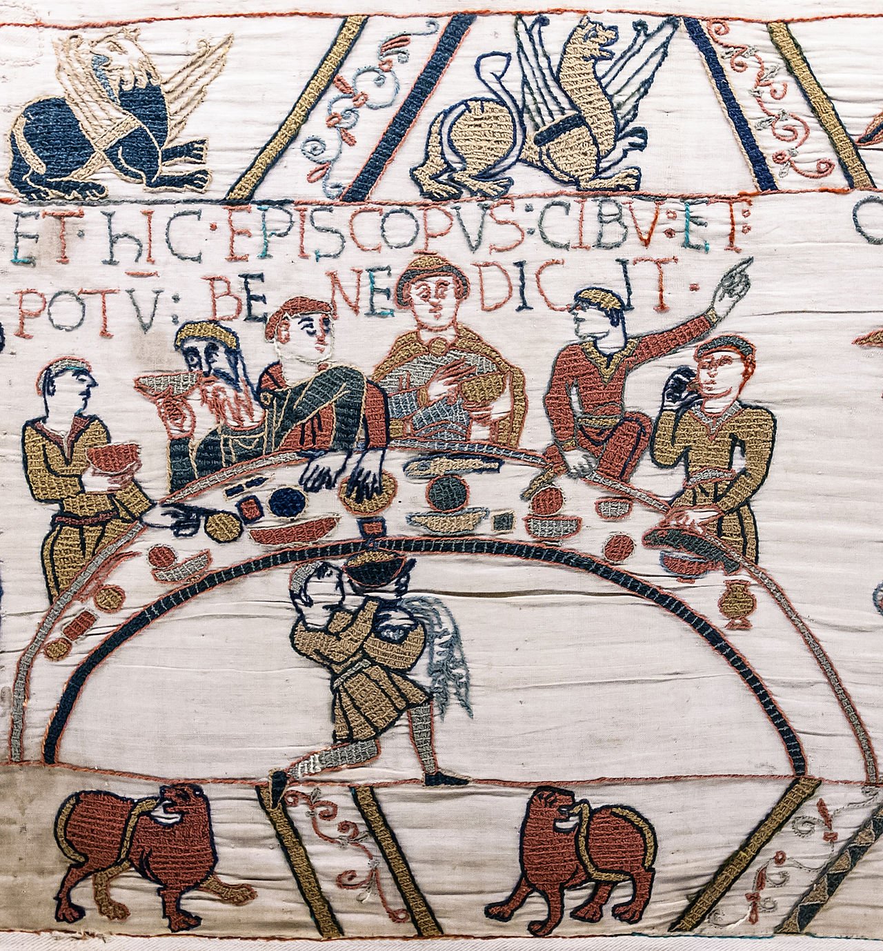 Bishop Odo blessing the food at a banquet in the Bayeux Tapestry