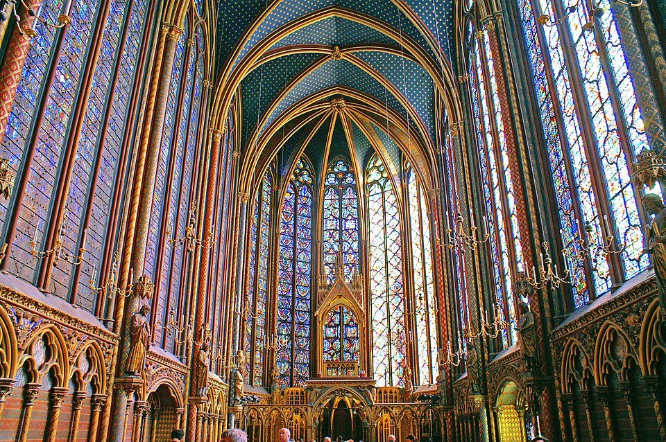 The upper chapel of the Sainte-Chapelle in Paris, where tall stained-glass windows fill almost every wall